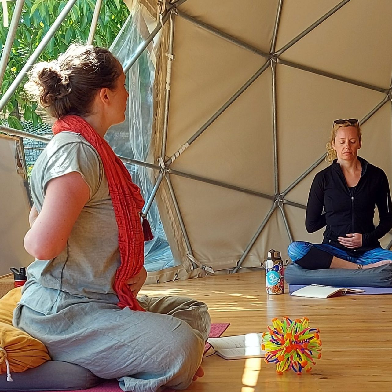 Katrin guiding a seated breathing practice