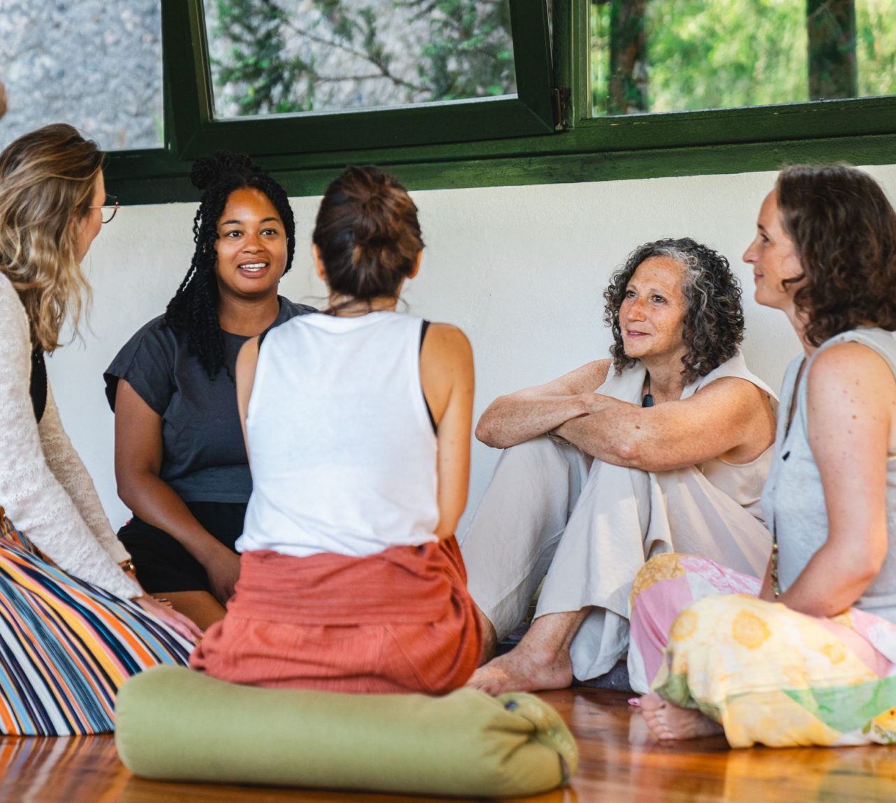 a circle of 5 women talking at ELEVATE