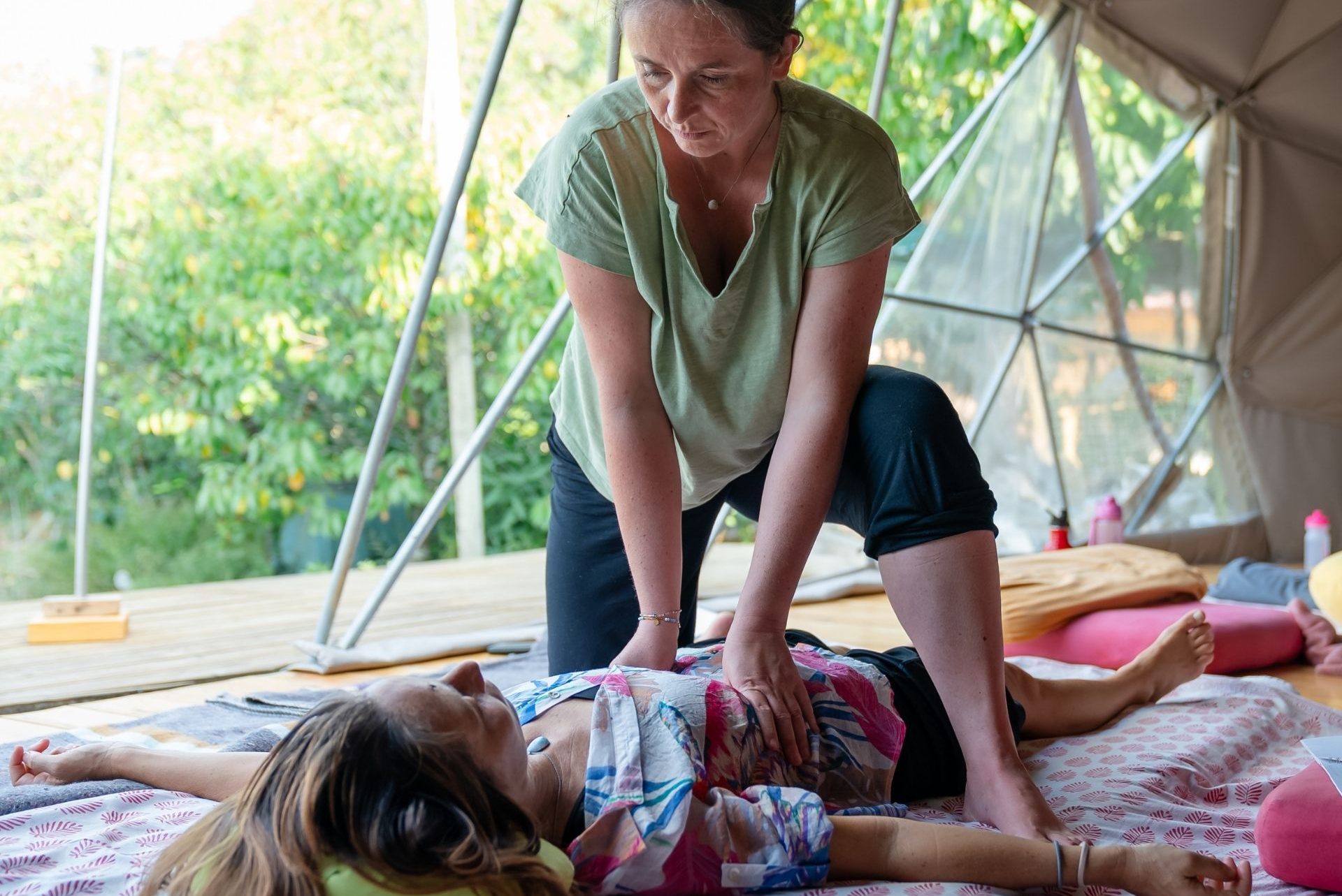 Katrin demonstrating a diaphragmatic release in Thai Massage class