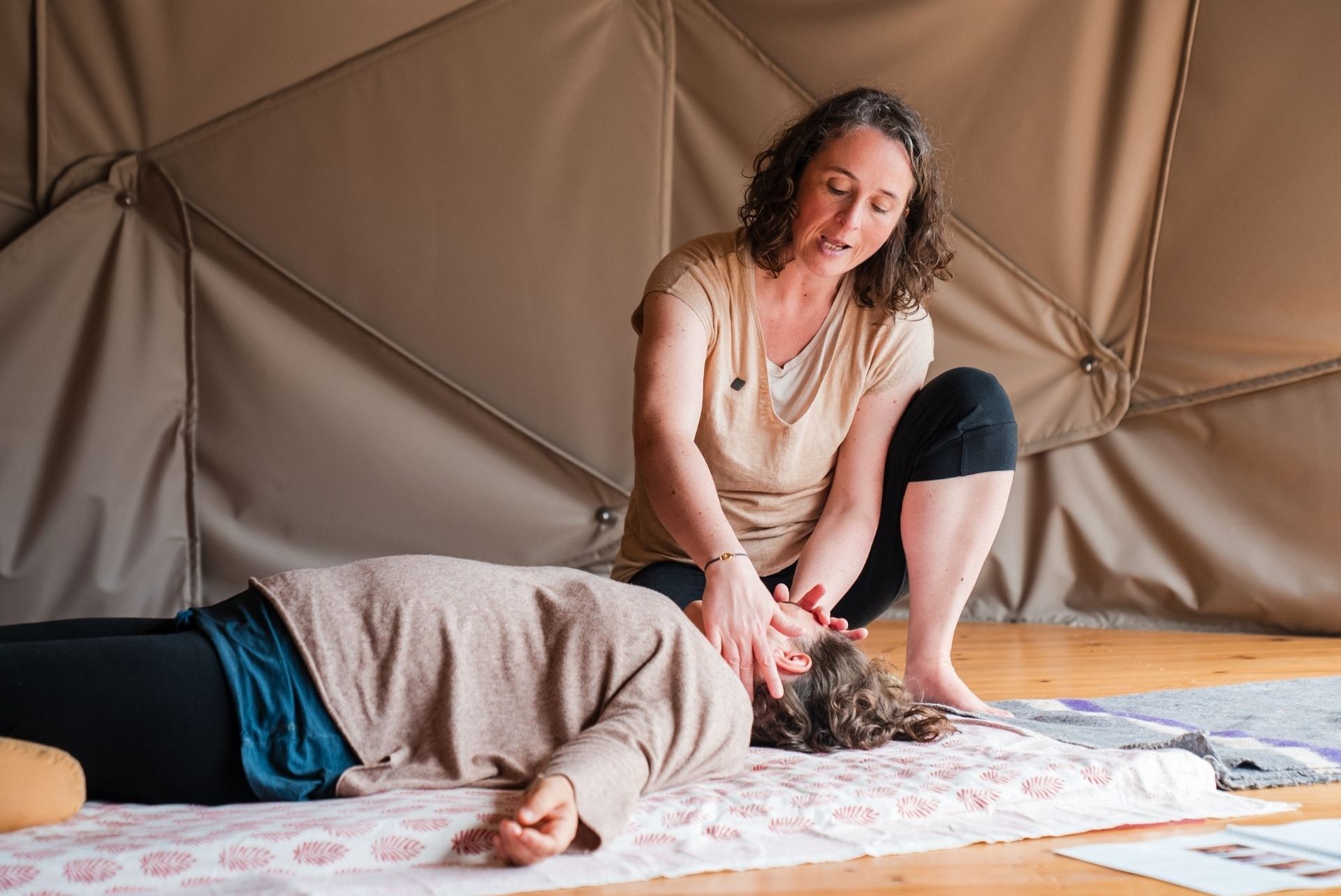 Katrin demonstrating a Thai Massage technique