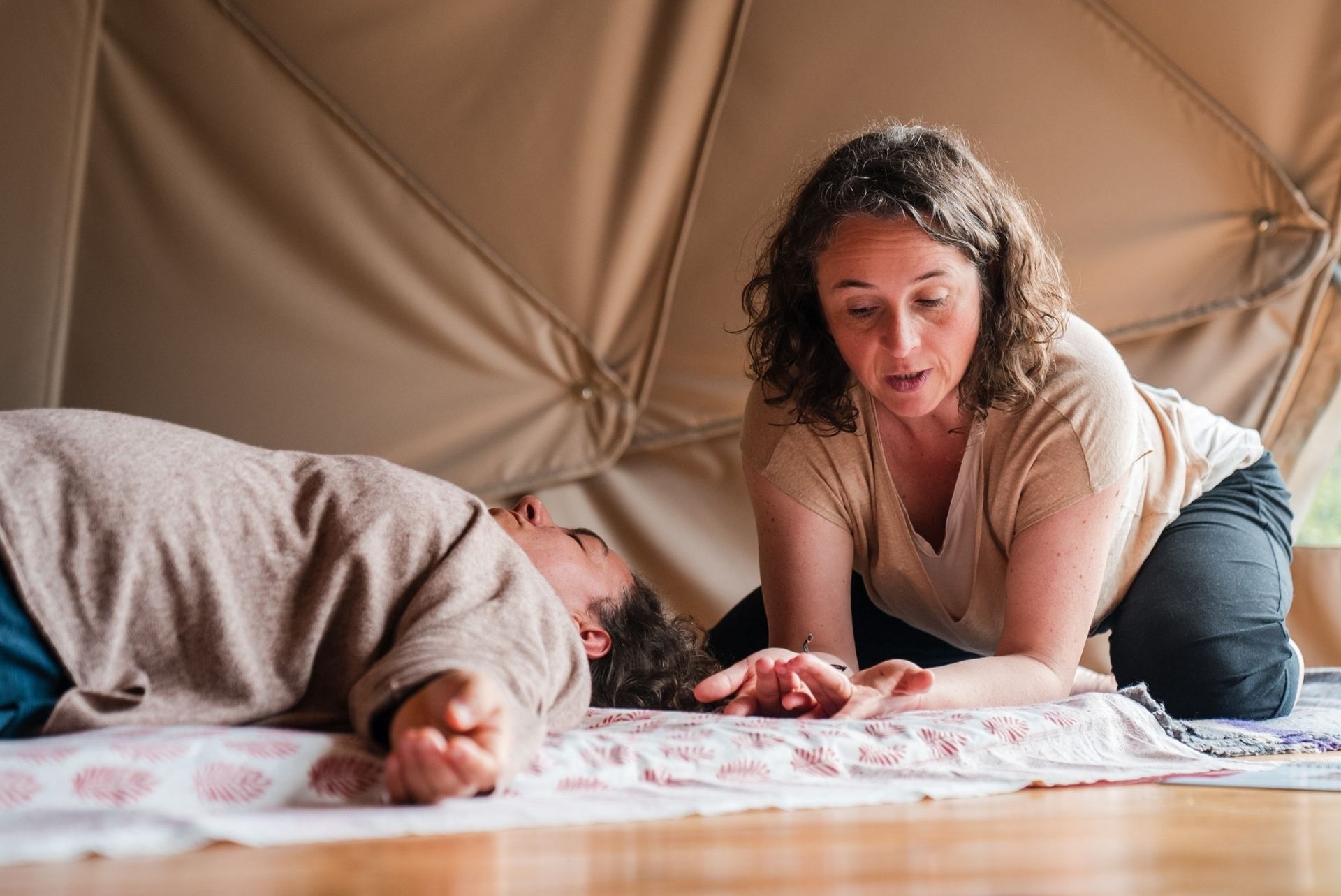 Katrin demonstrating a Thai Massage technique